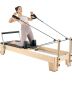 Wooden Pilates reformer trainer with resistance, up to 180 kg